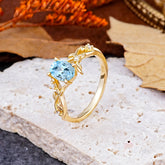 Nature-Inspired Branch-Wrapped 4-Prong Oval Aquamarine Engagement  Rings